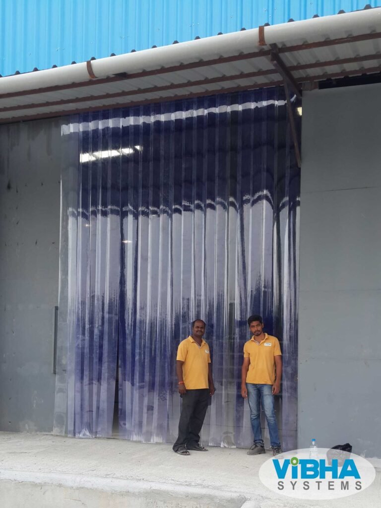 Transparent PVC strip curtain partitions in a Chennai food processing unit maintaining hygiene and dust control.