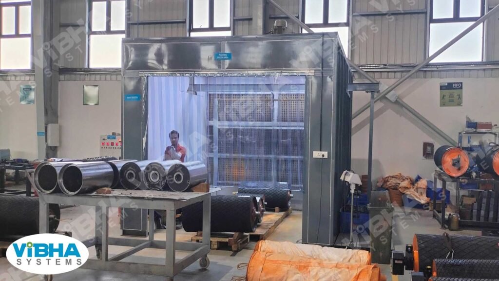 Transparent PVC strip curtains enclosing an automotive paint booth.