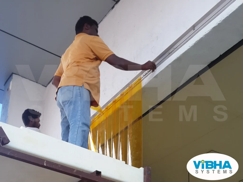 Insect amber PVC strip curtains installed in a Chennai pharmaceutical production clean zone to prevent insect contamination.